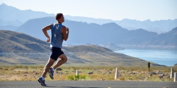 The benefits of running in the morning - a person running on the road in the morning and their is good amount of light